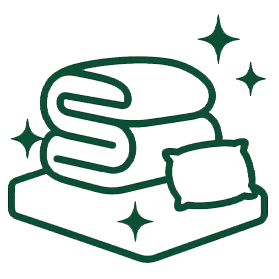 Outline of a folded blanket, pillow, and mattress with sparkle icons, suggesting cleanliness or freshness.